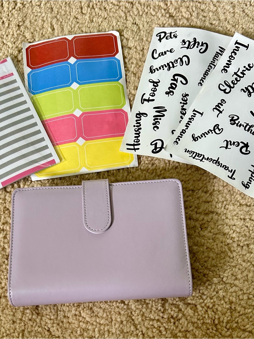 Lilac color budget binder with magnetic closure.